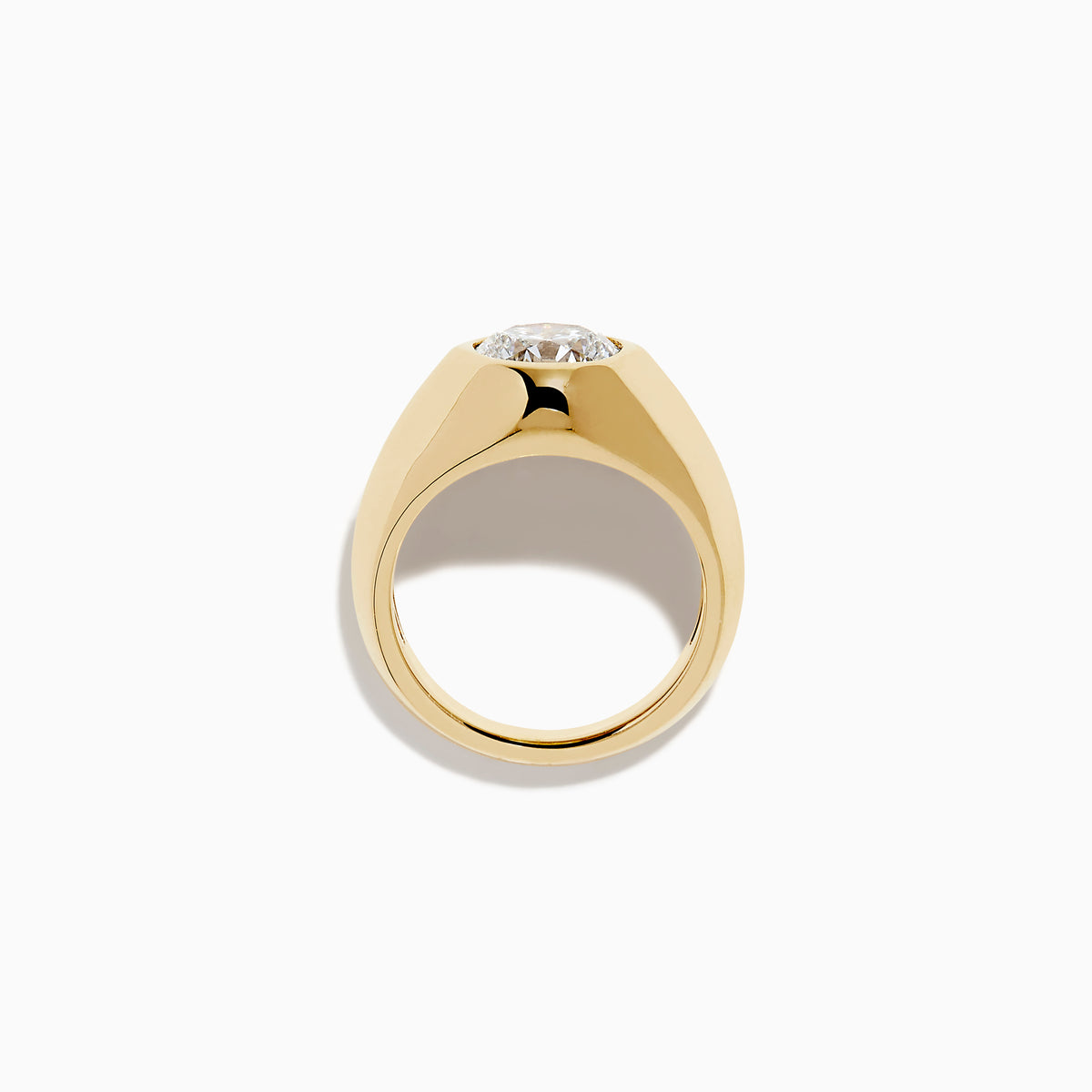 The Lab Grown Diamond Bezel Signet Pinky Ring in 14K Yellow Gold features a wide band and a large, round lab grown diamond at the center, shown against a plain white background.
