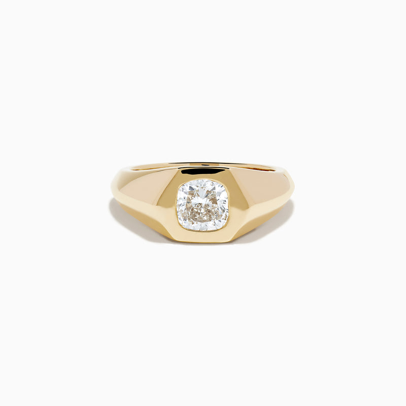 The Lab Grown Diamond Cushion Bezel Signet Pinky Ring in 14K Yellow Gold features a broad band with a cushion-cut lab-grown diamond set in a polished bezel, shown on a plain white background.
