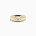 The Lab Grown Diamond Oval Bezel Pinky Ring in 14K Yellow Gold features a wide band and a prominent lab grown oval diamond set in the center.