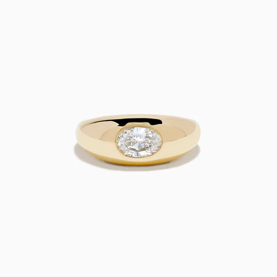 The Lab Grown Diamond Oval Bezel Pinky Ring in 14K Yellow Gold features a wide band and a prominent lab grown oval diamond set in the center.