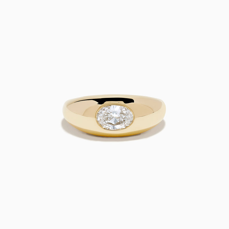 The Lab Grown Diamond Oval Bezel Pinky Ring in 14K Yellow Gold features a wide band and a prominent lab grown oval diamond set in the center.