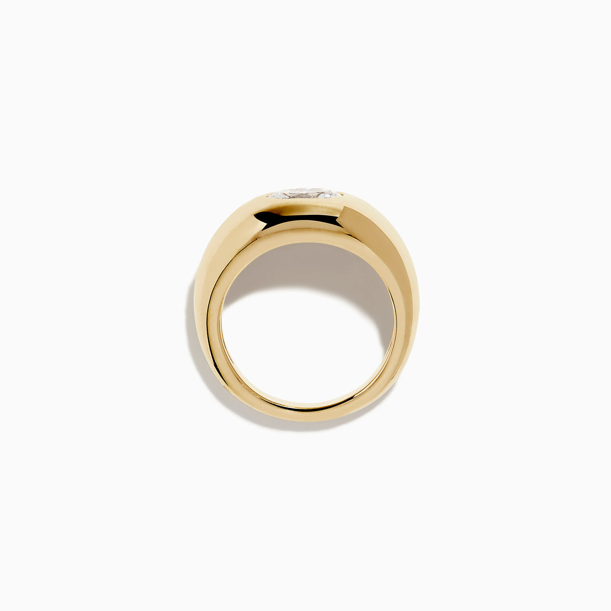 The Lab Grown Diamond Oval Bezel Pinky Ring in 14K Yellow Gold features a wide band and a prominent lab grown oval diamond set in the center.