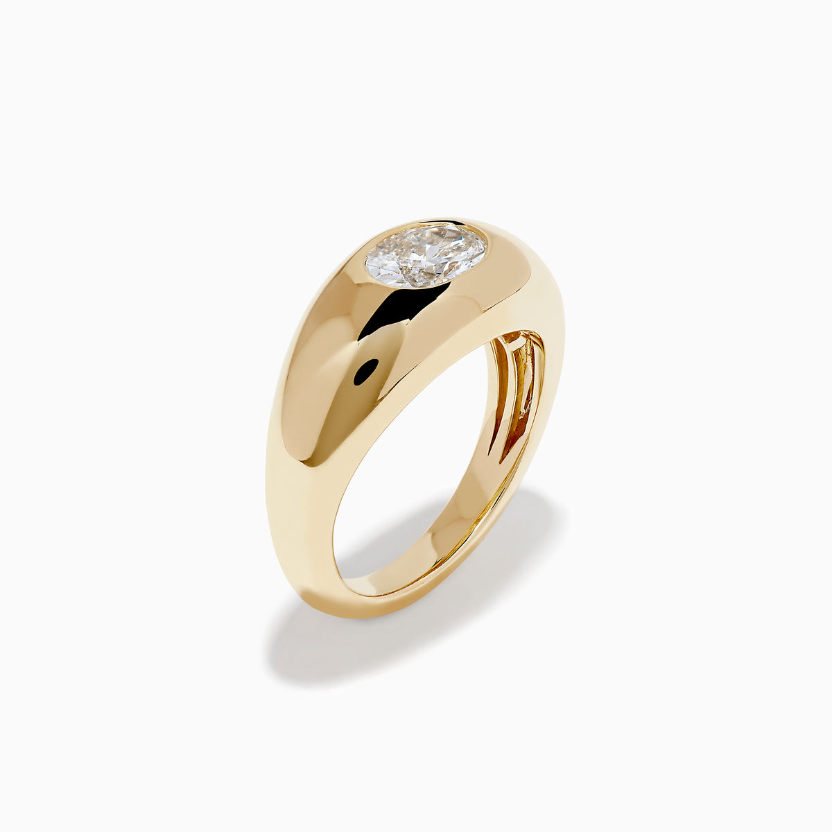 The Lab Grown Diamond Oval Bezel Pinky Ring in 14K Yellow Gold features a wide band and a prominent lab grown oval diamond set in the center.