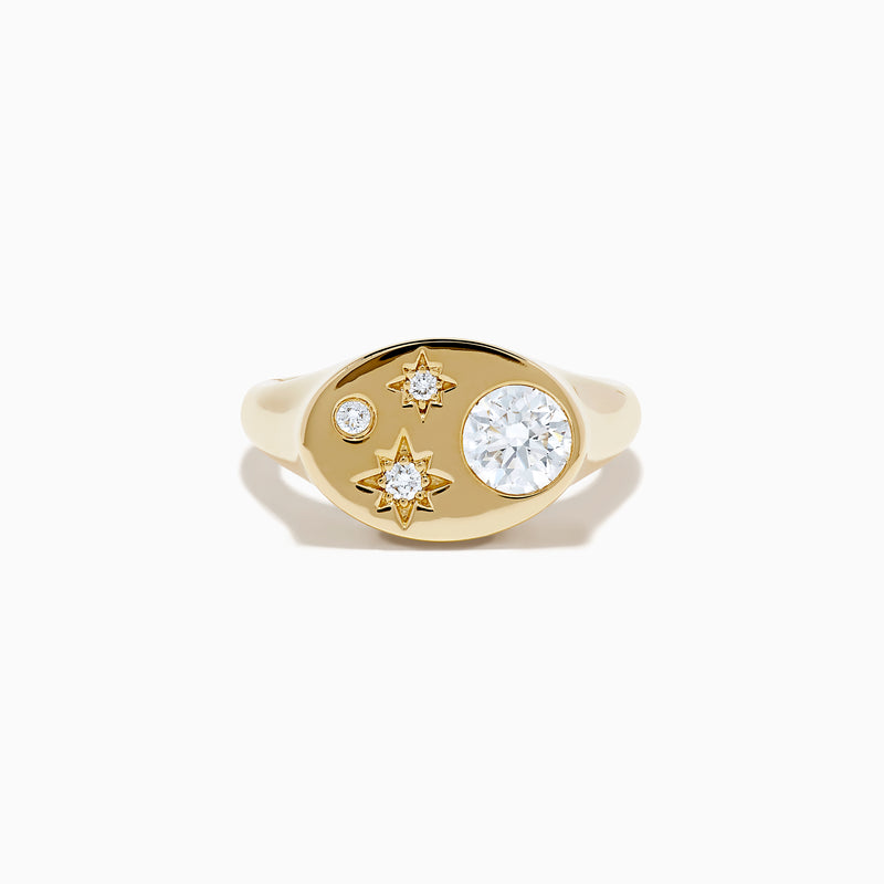 The Lab Grown Diamond Celestial Signet Pinky Ring in 14K Yellow Gold features a flat oval face with three star-shaped lab grown diamonds and one larger round diamond.