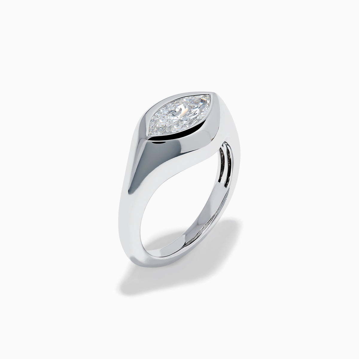 The Lab Grown Diamond Marquise Bezel Pinky Ring in 14K White Gold showcases a large marquise-shaped lab grown diamond set on a smooth, curved band, photographed against a white background.