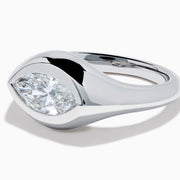 The Lab Grown Diamond Marquise Bezel Pinky Ring in 14K White Gold showcases a large marquise-shaped lab grown diamond set on a smooth, curved band, photographed against a white background.