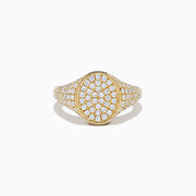 The Lab Grown Diamond Oval Pave Signet Pinky Ring in 14K yellow gold features a lustrous oval top and a band adorned with rows of sparkling lab grown diamonds, showcased on a white background.