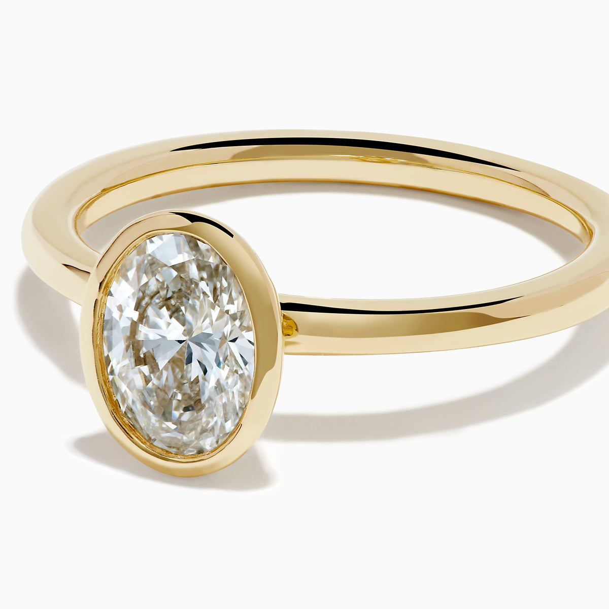 Lab Grown Diamond Oval Bezel-Set Solitaire Ring in 14K Yellow Gold