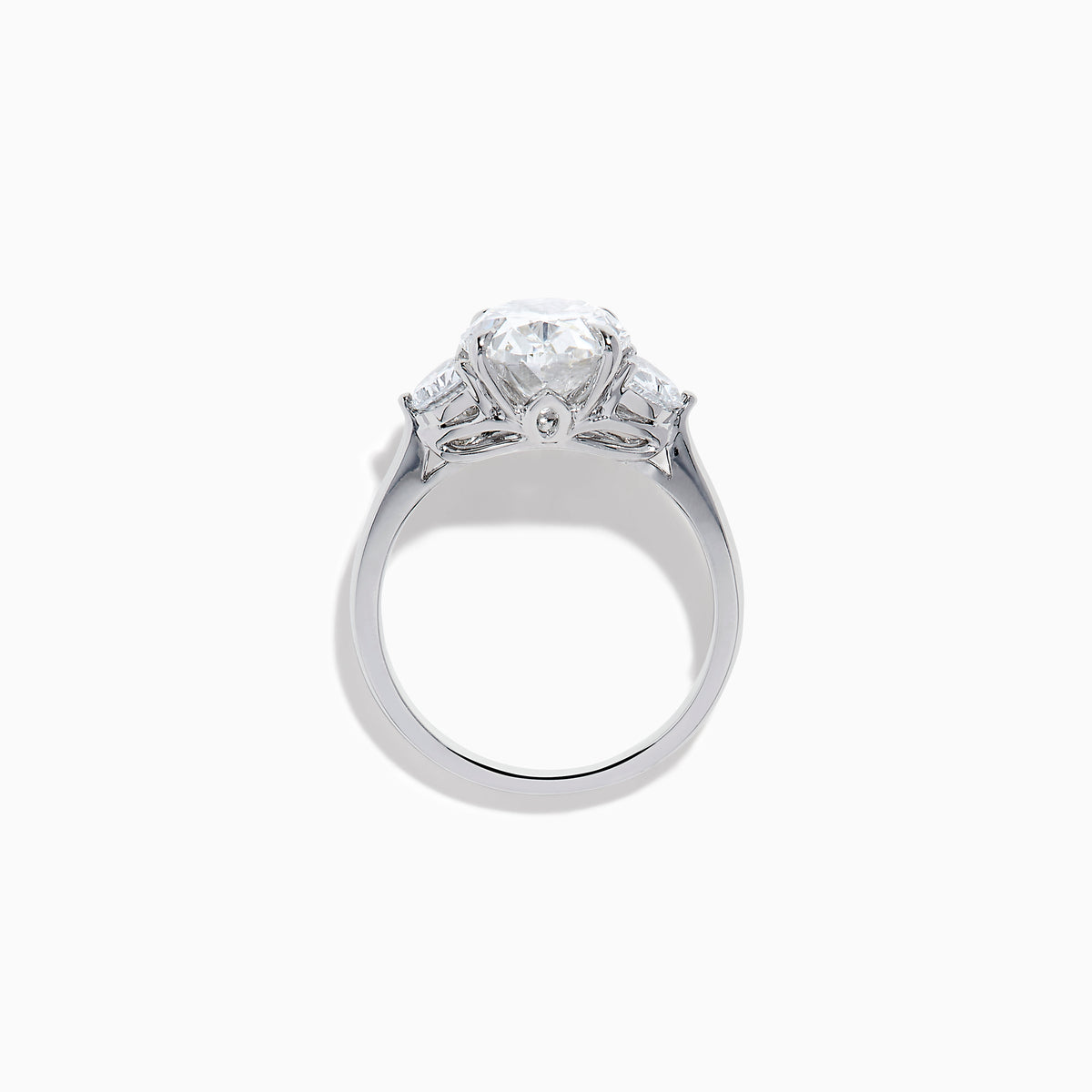 The Lab Grown Oval Diamond 3 Stone Ring in 14K White Gold features a striking lab grown oval diamond center, accented by two pear-shaped diamonds on each side.