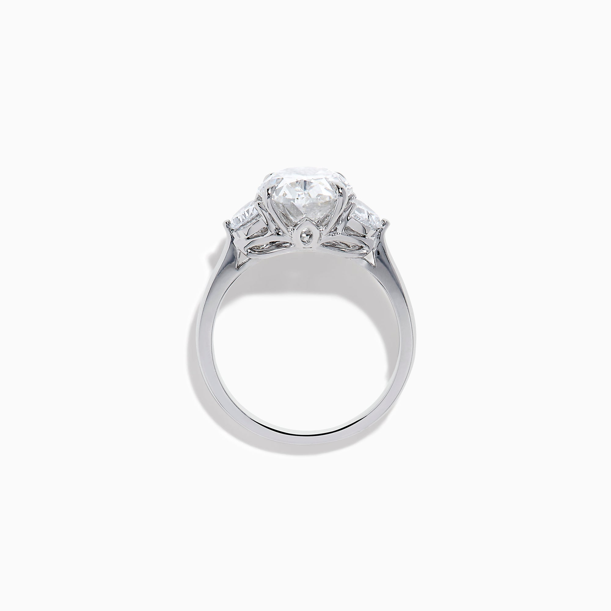 The Lab Grown Oval Diamond 3 Stone Ring in 14K White Gold features a striking lab grown oval diamond center, accented by two pear-shaped diamonds on each side.