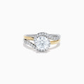 The Lab Grown Diamond Swirl Halo Ring in 14K Two-Tone Gold features a large round lab grown diamond center, surrounded by smaller diamonds in a spiral halo and set on dual gold and silver bands against a crisp white background.
