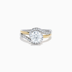 The Lab Grown Diamond Swirl Halo Ring in 14K Two-Tone Gold features a large round lab grown diamond center, surrounded by smaller diamonds in a spiral halo and set on dual gold and silver bands against a crisp white background.