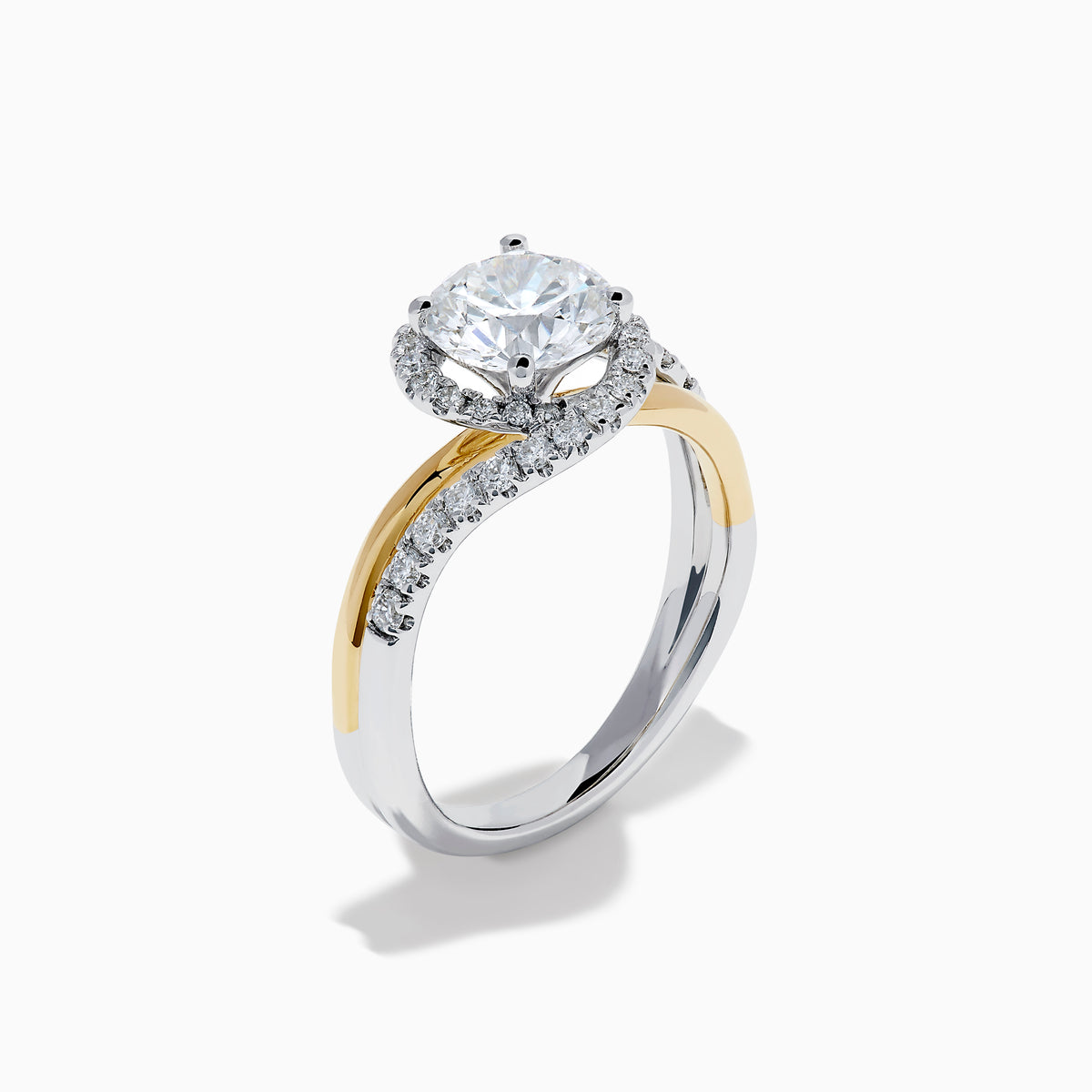 The Lab Grown Diamond Swirl Halo Ring in 14K Two-Tone Gold features a large round lab grown diamond center, surrounded by smaller diamonds in a spiral halo and set on dual gold and silver bands against a crisp white background.