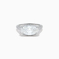 The Lab Grown Diamond East-West Oval Halo Ring in 14K White Gold showcases a brilliant lab-grown diamond center, accented by sparkling stones along the band, beautifully set against a plain white background.