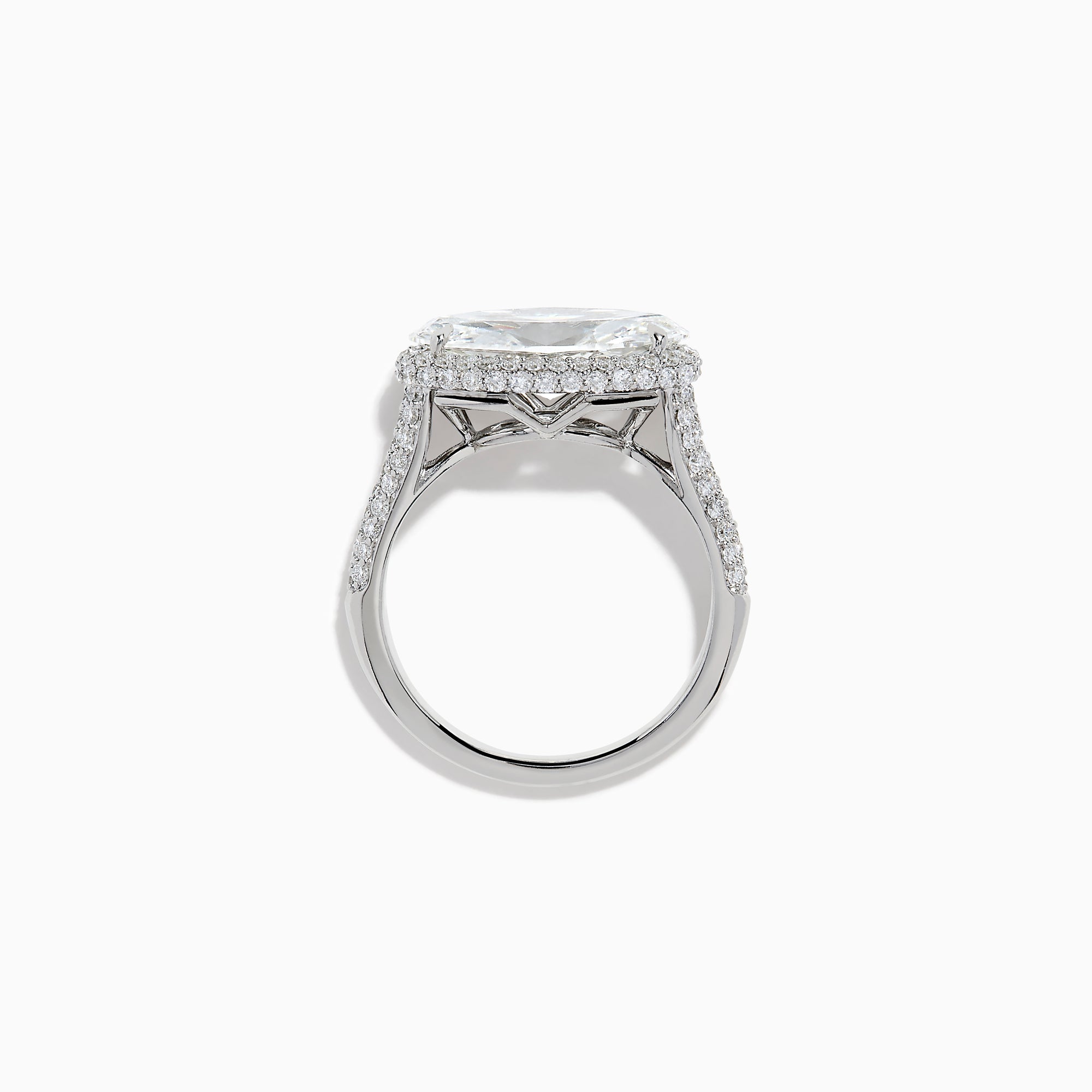 The Lab Grown Diamond East-West Oval Halo Ring in 14K White Gold showcases a brilliant lab-grown diamond center, accented by sparkling stones along the band, beautifully set against a plain white background.