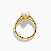 The Lab Grown Elongated Pear Shaped Diamond Halo Ring in 14K Yellow Gold features a large pear-shaped lab-grown diamond surrounded by a halo of smaller round diamonds, displayed on a plain white background.