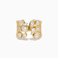 The Lab Grown Multi Shape Diamond Open Shank Textured Ring in 14K Yellow Gold features an open front with oval and marquise lab-grown diamonds arranged in a scattered, leaf-inspired pattern.