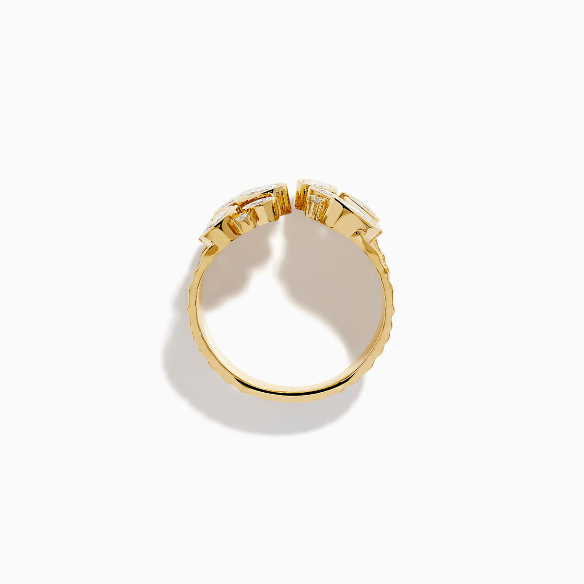 The Lab Grown Multi Shape Diamond Open Shank Textured Ring in 14K Yellow Gold features an open front with oval and marquise lab-grown diamonds arranged in a scattered, leaf-inspired pattern.