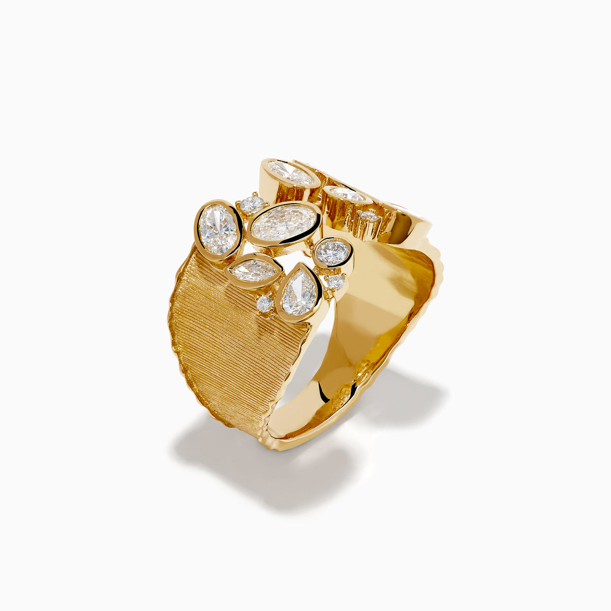 The Lab Grown Multi Shape Diamond Open Shank Textured Ring in 14K Yellow Gold features an open front with oval and marquise lab-grown diamonds arranged in a scattered, leaf-inspired pattern.
