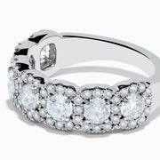 The 14K White Gold Diamond Ring showcases a row of large round diamonds, each encircled by smaller diamonds, forming a sparkling floral design across the band—a stunning example of diamond ring artistry.