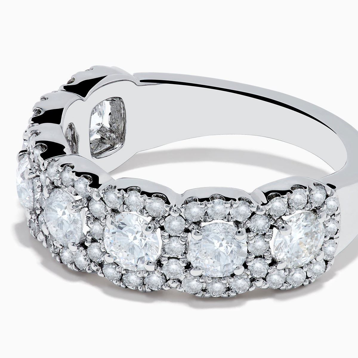The 14K White Gold Diamond Ring showcases a row of large round diamonds, each encircled by smaller diamonds, forming a sparkling floral design across the band—a stunning example of diamond ring artistry.