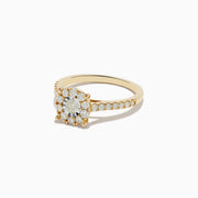 The Duo 14K Yellow and White Gold Diamond Cluster Ring (0.73 TCW) features a round center diamond with a halo of smaller diamonds and additional diamonds along the band.