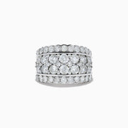 The Pave Classica 14K White Gold Diamond Statement Ring 4.84 TCW showcases three rows of round-cut diamonds, with a center row of larger stones framed by two rows of smaller diamonds—a dazzling statement piece.