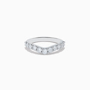 The 14K White Gold Contoured Diamond Stacking Band 0.95 TCW features a chevron shape with round diamonds along the front, showcased against a plain white background to emphasize its shine and elegance.