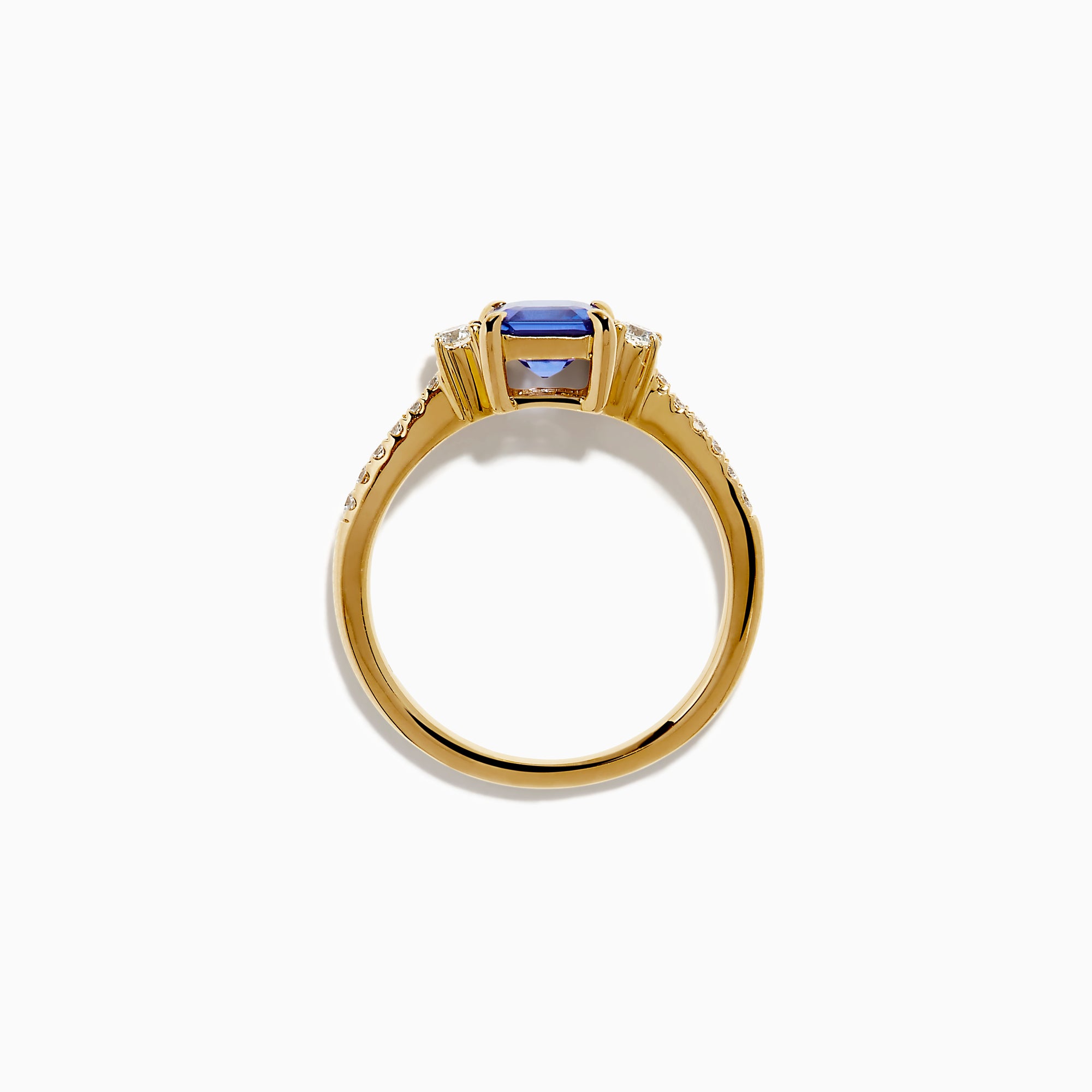 The 14K Yellow Gold Tanzanite and Diamond Ring showcases a square-cut blue tanzanite centerpiece, accented by round white diamonds set along the band.