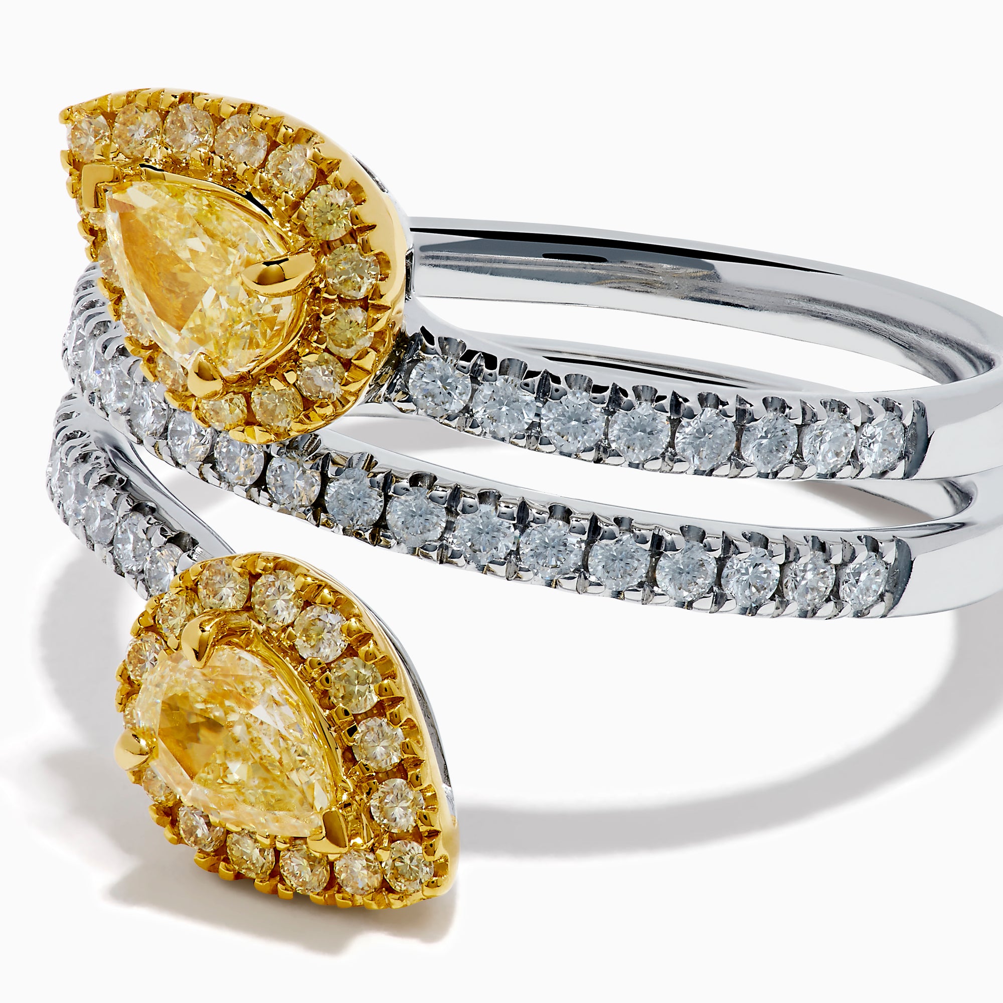The 18K Two-Tone Gold Yellow and White Diamond Wrap Bypass Ring features pear-shaped diamond clusters haloed by smaller diamonds on a split gold band sparkling with round white diamonds.