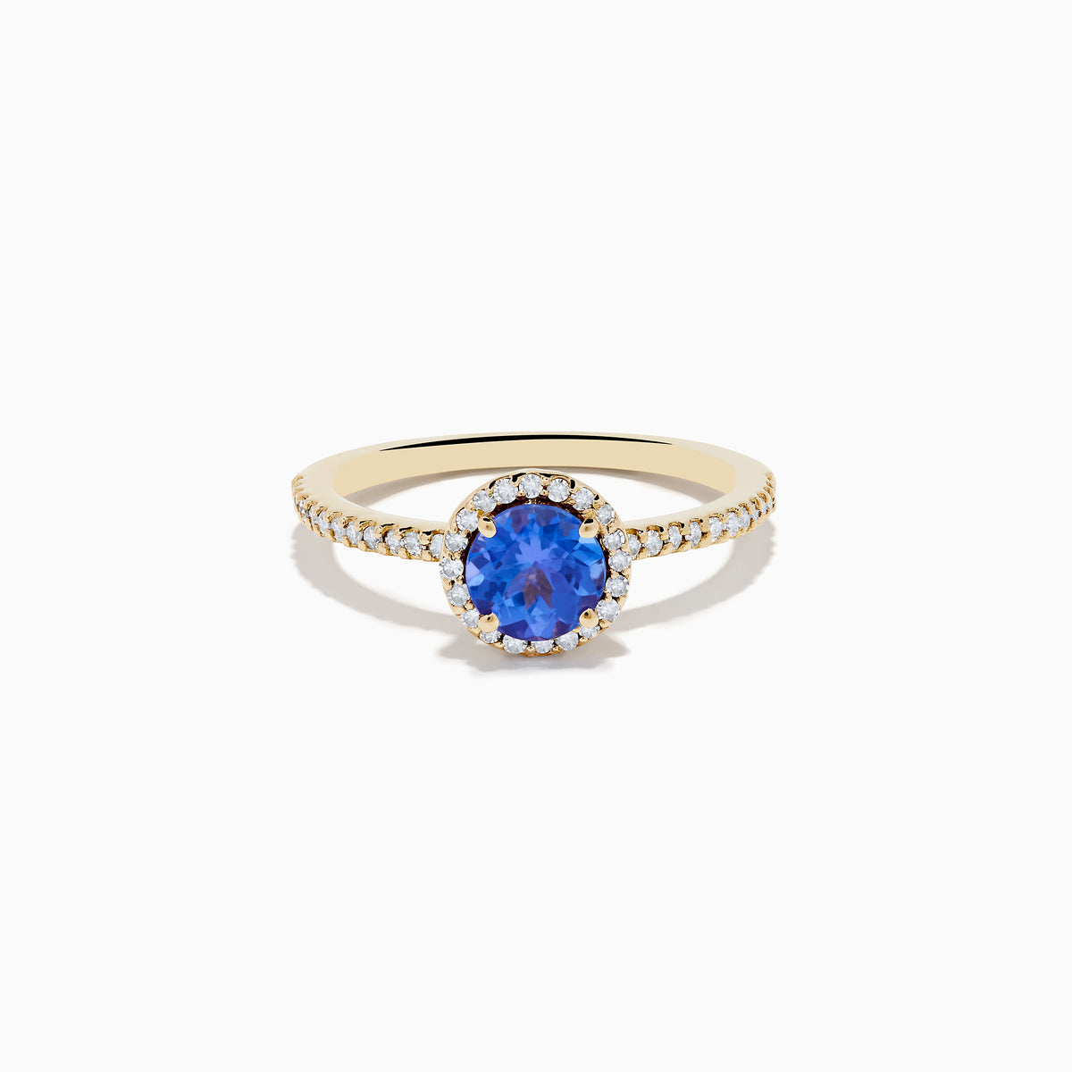 The Nahla 14K Yellow Gold Tanzanite and Diamond Ring showcases a round tanzanite center, encircled by a halo of clear diamonds and accented with additional diamonds along the band.