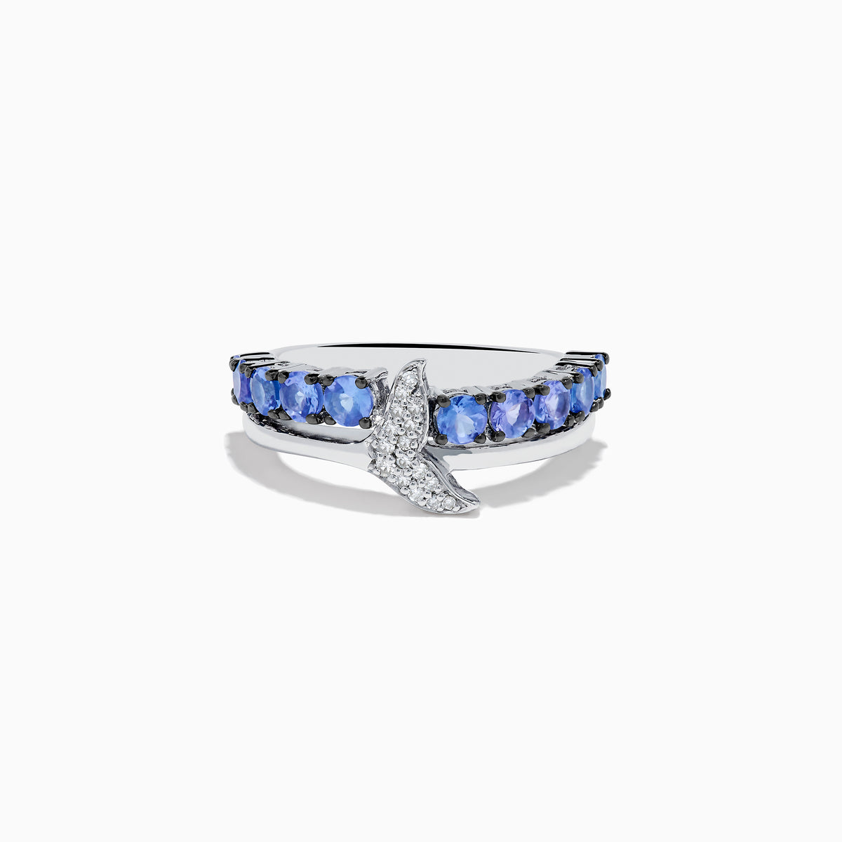 The 925 Sterling Silver Tanzanite and Diamond Fin Ring showcases tanzanite stones across the band, accented with a crescent design adorned with sparkling diamonds.
