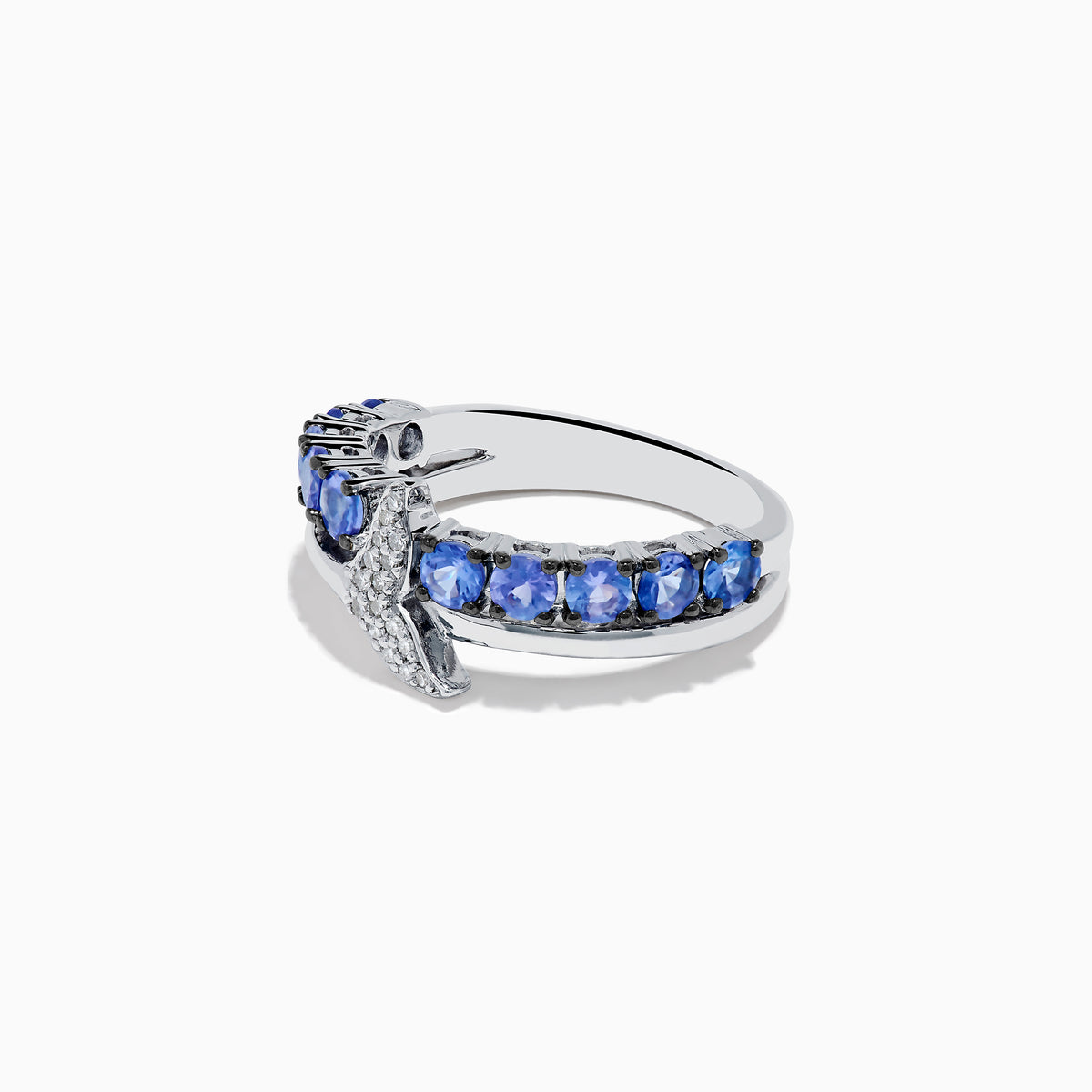 The 925 Sterling Silver Tanzanite and Diamond Fin Ring showcases tanzanite stones across the band, accented with a crescent design adorned with sparkling diamonds.