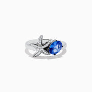 The Nahla Siri 925 Silver Tanzanite and Diamond Starfish Ring features a diamond-studded starfish next to an oval tanzanite gemstone, all displayed on a plain white background.