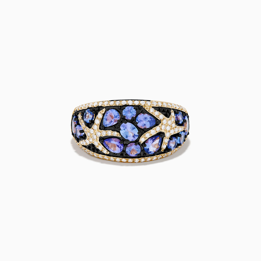 The Nahla 14K Yellow Gold Tanzanite and Diamond Starfish Ring showcases round and pear-shaped blue tanzanites with white and black diamond accents in an intricate, starfish-inspired design.