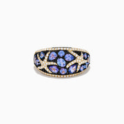 The Nahla 14K Yellow Gold Tanzanite and Diamond Starfish Ring showcases round and pear-shaped blue tanzanites with white and black diamond accents in an intricate, starfish-inspired design.