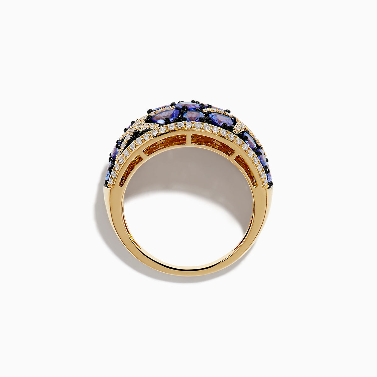 The Nahla 14K Yellow Gold Tanzanite and Diamond Starfish Ring showcases round and pear-shaped blue tanzanites with white and black diamond accents in an intricate, starfish-inspired design.