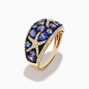 The Nahla 14K Yellow Gold Tanzanite and Diamond Starfish Ring showcases round and pear-shaped blue tanzanites with white and black diamond accents in an intricate, starfish-inspired design.