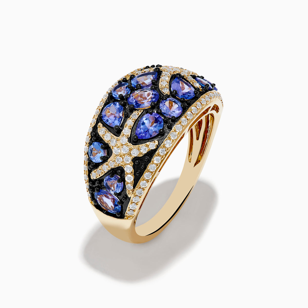 The Nahla 14K Yellow Gold Tanzanite and Diamond Starfish Ring showcases round and pear-shaped blue tanzanites with white and black diamond accents in an intricate, starfish-inspired design.