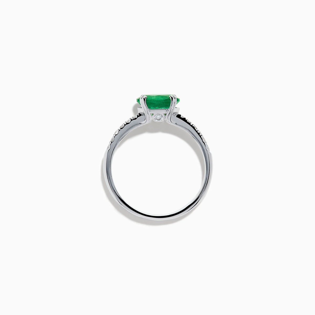 The 14K White Gold East West Oval Emerald and Diamond Ring showcases a striking green oval emerald set horizontally, accented by sparkling diamonds along the band.