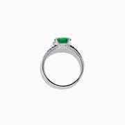 The 14K White Gold East West Oval Emerald and Diamond Ring showcases a striking green oval emerald set horizontally, accented by sparkling diamonds along the band.
