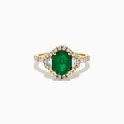 The Brasilica 14K Yellow Gold Emerald and Diamond 3 Stone Ring features an oval green emerald and sparkling diamonds on a diamond-studded band—an elegant choice for any occasion.