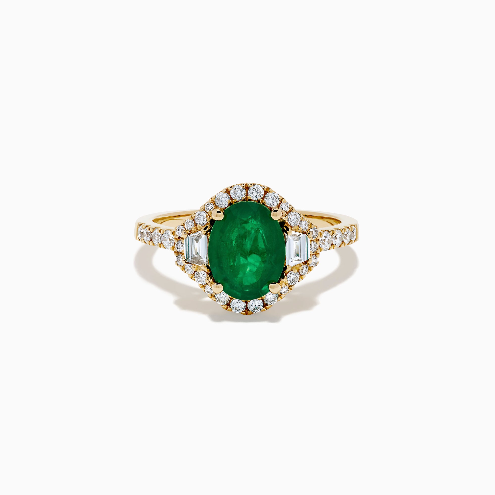 The Brasilica 14K Yellow Gold Emerald and Diamond 3 Stone Ring features an oval green emerald and sparkling diamonds on a diamond-studded band—an elegant choice for any occasion.