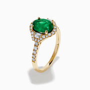 The Brasilica 14K Yellow Gold Emerald and Diamond 3 Stone Ring features an oval green emerald and sparkling diamonds on a diamond-studded band—an elegant choice for any occasion.