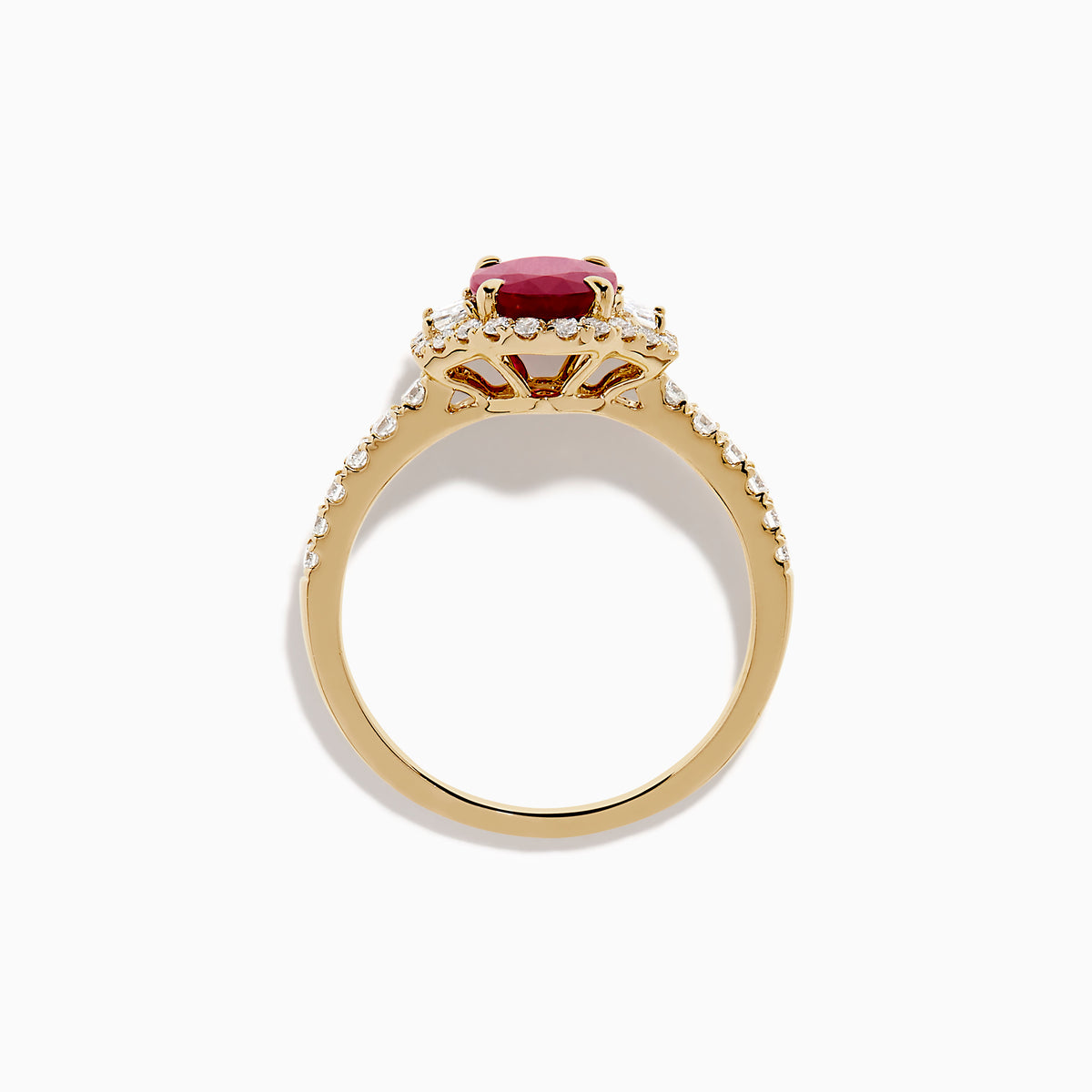 The Ruby Royale 14K Yellow Gold Ruby and Diamond 3 Stone Ring showcases a central oval ruby flanked by sparkling diamonds, set on a diamond-accented band and elegantly displayed against a white background.