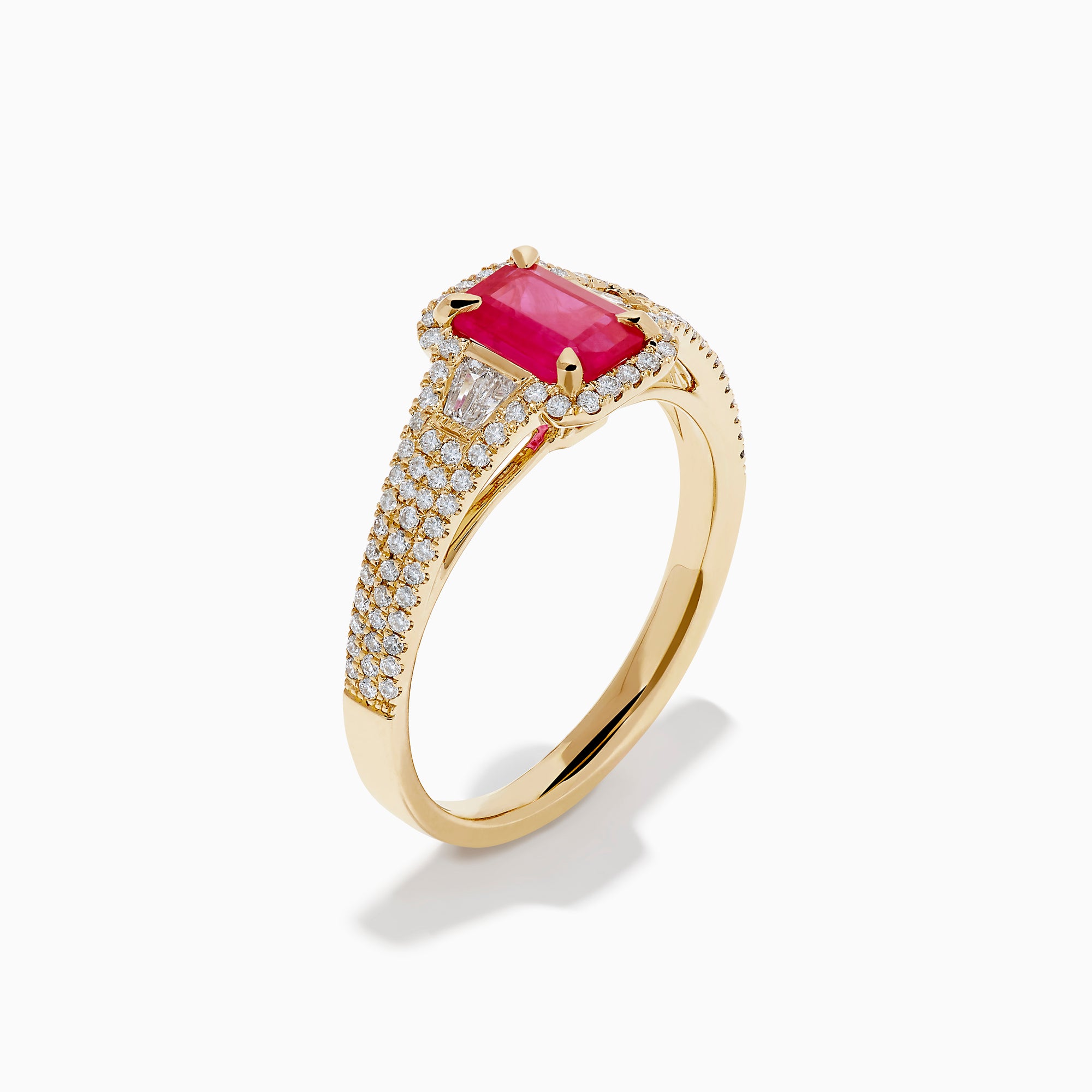 The 14K Yellow Gold Emerald Cut Ruby and Pave Diamond Halo Ring features a central emerald-cut ruby, diamond accents, and a shimmering halo for added brilliance.