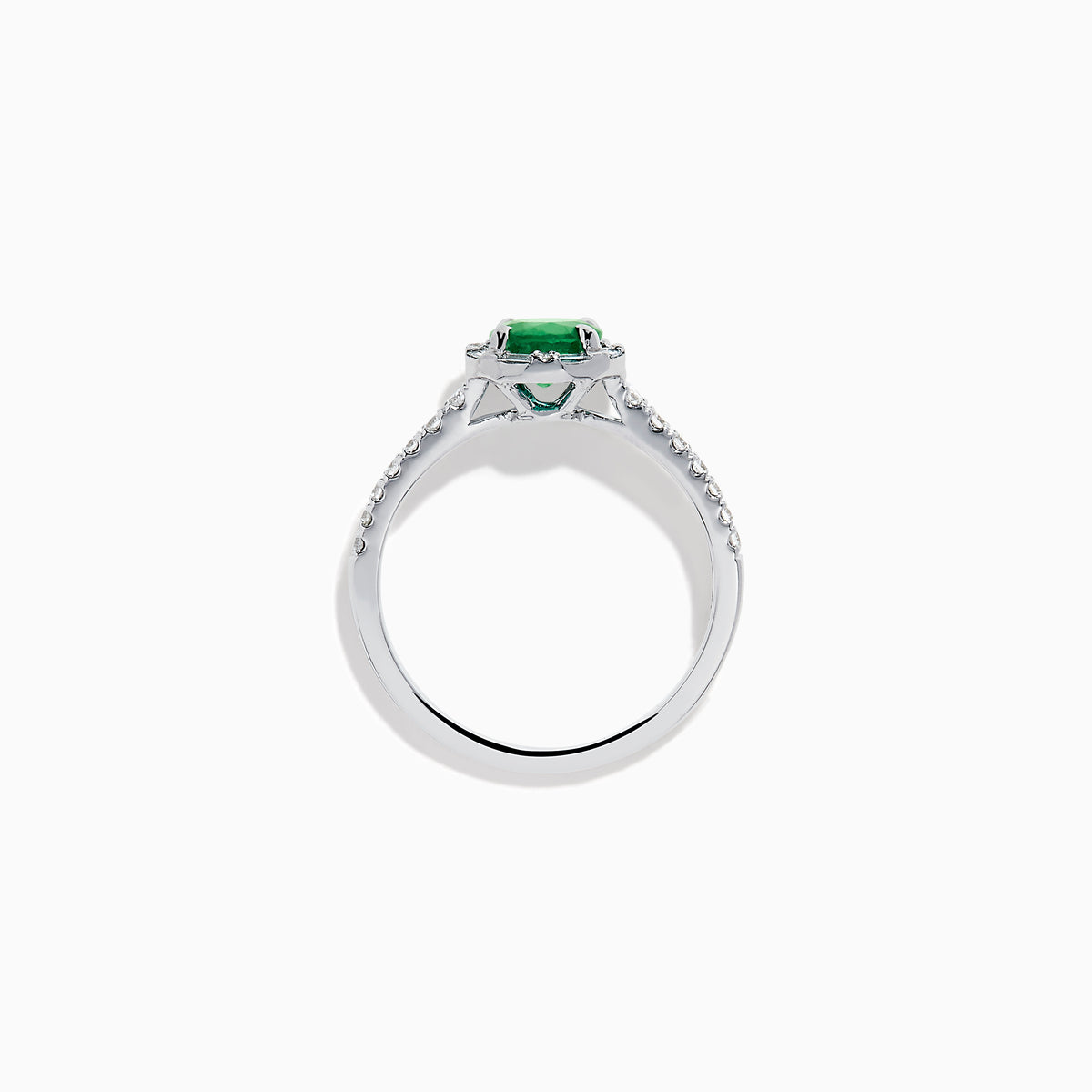 Introducing the 14K White Gold Emerald and Diamond Baguette Halo Ring, showcasing a round green emerald center stone, diamond baguette halo, and a band embellished with shimmering clear stones for added elegance.