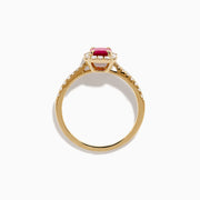 The Ruby Royale 14K Yellow Gold Ruby and Diamond Halo Ring features a rectangular ruby center, surrounded by a halo of round and baguette diamonds, with extra diamond accents on the band for added brilliance.