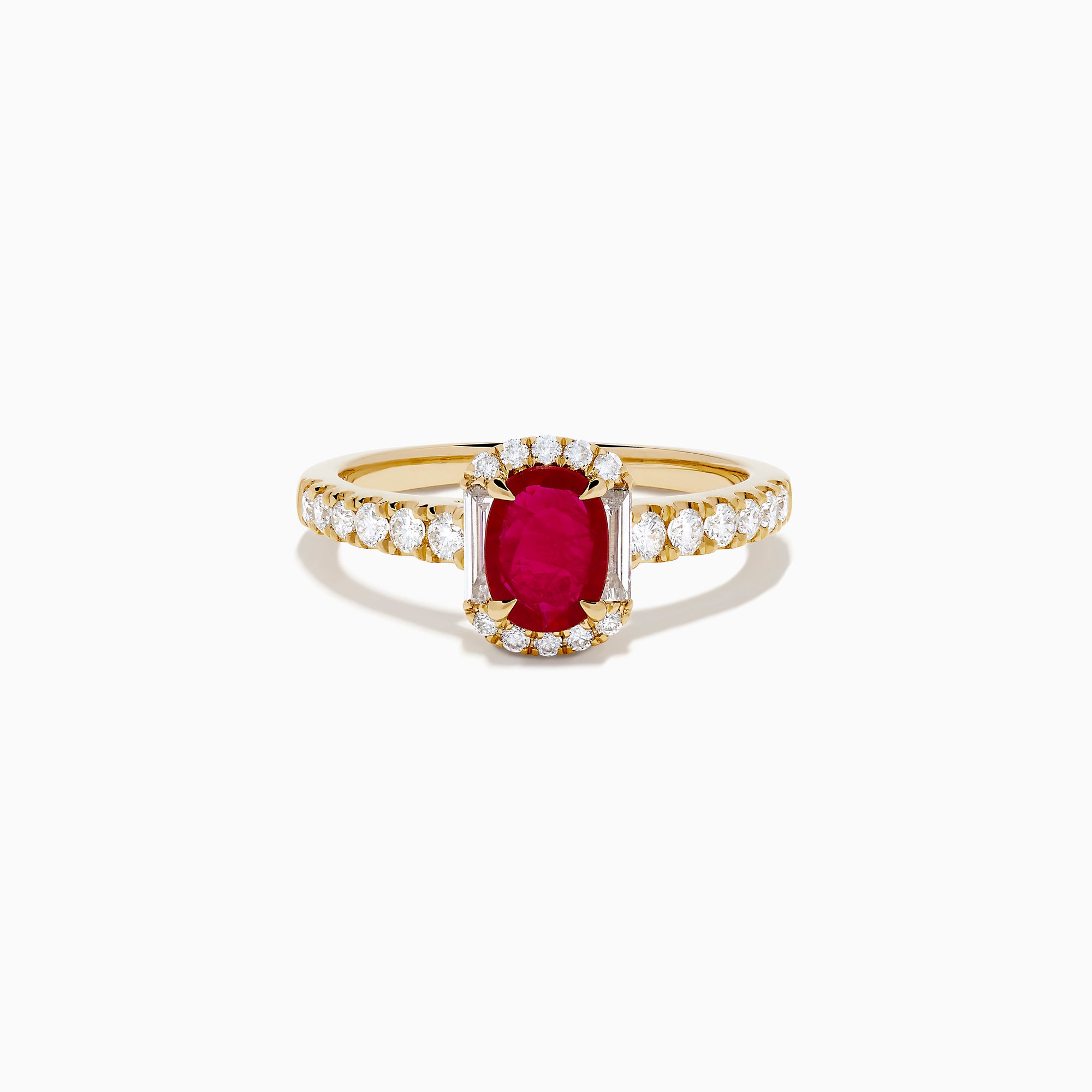 The 14K Yellow Gold Oval Ruby and Diamond Halo Ring features a central oval ruby surrounded by a sparkling diamond halo, with additional diamonds adorning the elegant band.