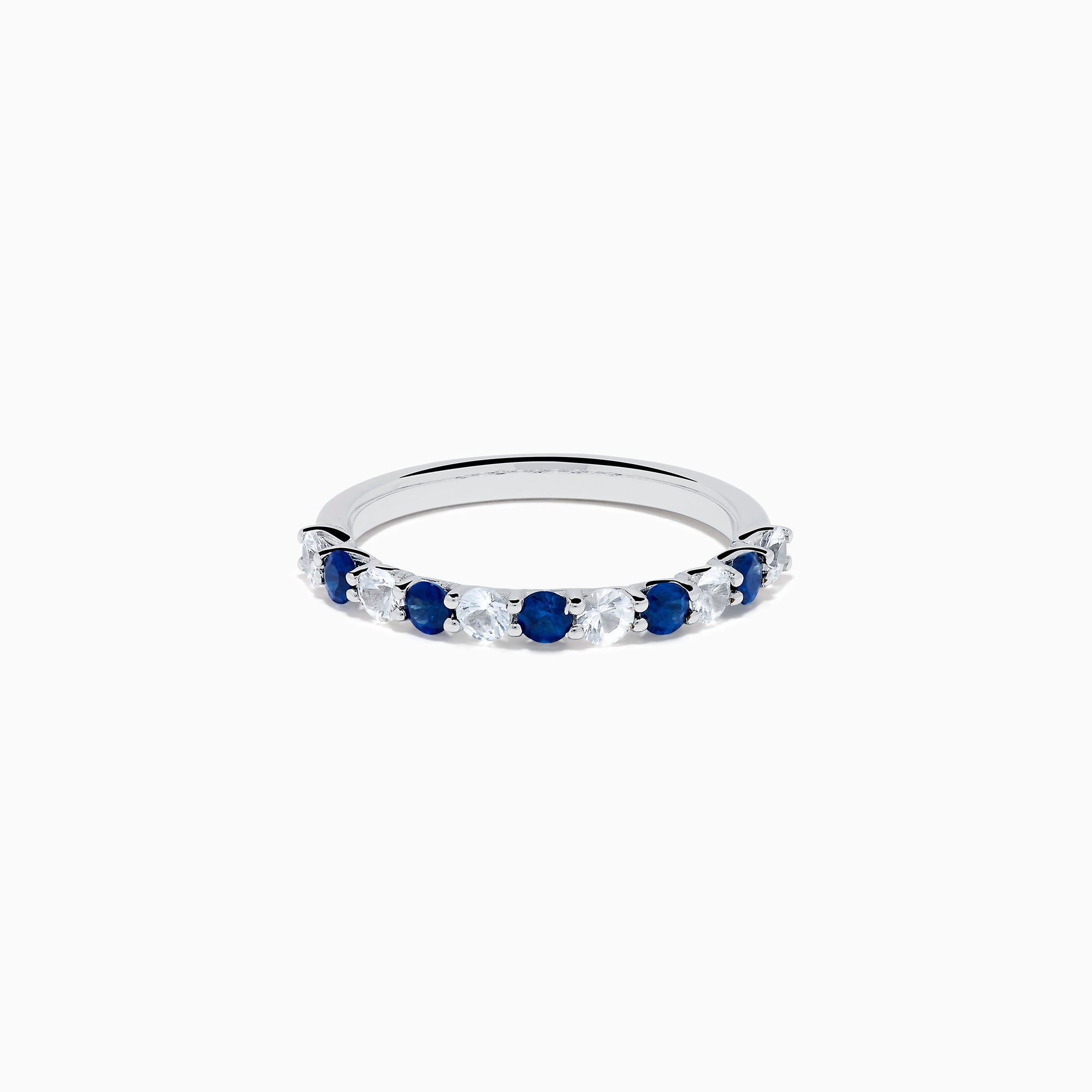 The Royale Bleu 14K White Gold Blue and White Sapphire Band Ring features alternating round blue and white sapphires on a sleek white gold band, shown against a white background.